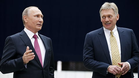 Russian President Vladimir Putin with Kremlin spokesman Dmitry Peskov.