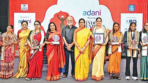 Devi awardees pose for a group photograph after the presentation ceremony in Bhubaneswar on Sunday. In the frame (left to right) Shyni S, Nina Singh, Laxmi Meher, 
TNIE CEO Lakshmi Menon, Paramita Satpathy, Aruna Mohanty, TNIE Editorial Director Prabhu Chawla, deputy chief minister Pravati Parida, Prof Debasmita Pankaj Alone, Nalini Kandi, Jayanti Behera, Sujata Priyambada Choudhury and Sumona Karjee Mishra | DEBADATTA MALLICK
