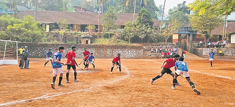 Students play hockey at a practice session at Kodur Chemmankadavu PMSAMA HSS