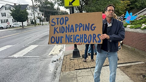 Anti-ICE activists gather outside a courthouse in Danbury, Conn., Thursday, Aug. 27, 2026.