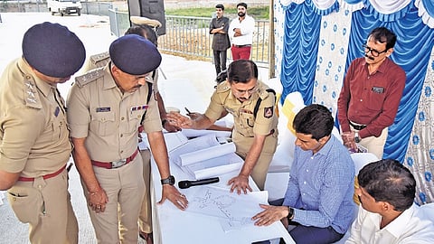 Minister Rizwan Arshad gets briefed by the police on the routes for Ganesha processions on Monday 