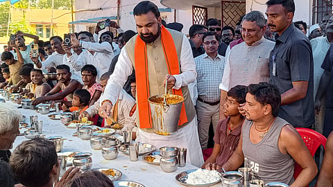 Bihar Chief Minister Samrat Choudhary serves food to flood-affected people at a relief camp, in Saran, Monday, Sept. 7, 2026.
