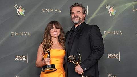 Linda Cardellini, left, and David Harbour pose in the press room with the awards for outstanding supporting actress in a limited or anthology series or movie and outstanding supporting actor in a limited or anthology series or movie for "DTF St. Louis" during night two of the Creative Arts Emmy Awards on Sunday, Sept. 6, 2026, in Los Angeles.