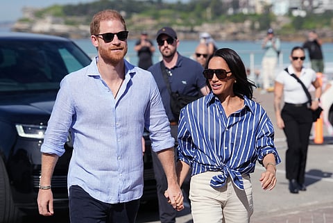 Prince Harry, and Meghan, the Duke and Duchess of Sussex, arrive for an event during a visit to Bondi Beach, Australia, in April.  