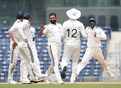 Mohammed Shami (C) celebrates a wicket with his East Zone  teammates