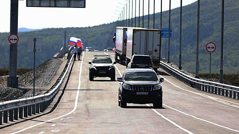 In this photo released by the Government of Primorsky Krai Region on Monday, Sept. 7, 2026, vehicles drive across the new bridge between Russia and North Korea named after the Soviet officer Yakov Novichenko