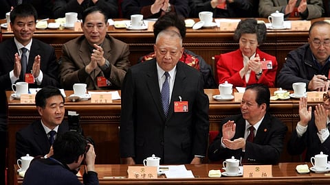 Hong Kong Chief Executive Tung Chee-hwa stands to acknowledge the applause of his colleagues after he was named a vice chairman of the Chinese People's Political Consultative Conference (CPPCC) during a closing ceremony held at the Great Hall of the People in Beijing, March 12, 2005. 