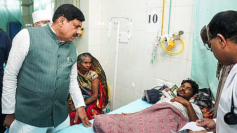  Madhya Pradesh Chief Minister Mohan Yadav interacts with the hooch tragedy victim undergoing treatment at GMC Hospital, in Sagar on Wednesday.
