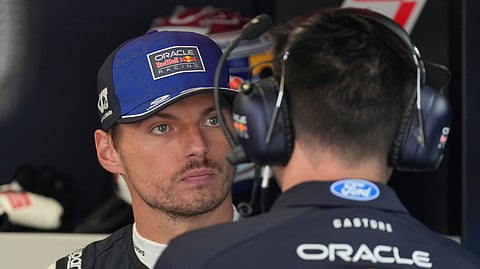 Red Bull driver Max Verstappen of the Netherlands talks to a teammate before the second free practice ahead of the Italian Formula One Grand Prix in Monza, Italy, Friday, Sept. 4, 2026.