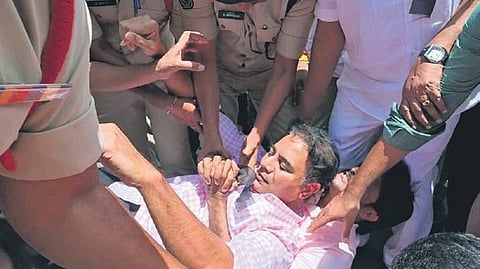 Cops detain BRS working president KT Rama Rao during his padayatra to Erravelli.