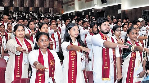 Graduates take a pledge during the 85th Annual Convocation of the Osmania University in Hyderabad on Tuesday 