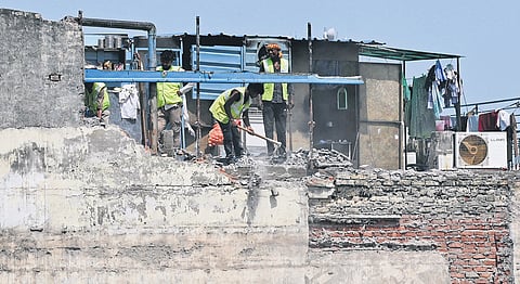 Demolition of building adjoining the collapsed Satya Niketan structure began on Wednesday