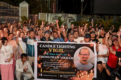 People participate in a candlelight vigil at the Western Gate of Kangla condemning the killing of Manipuri musician Chongtham Vikram Singh in New Delhi, in Imphal, Manipur, Tuesday, Sept. 8, 2026. 