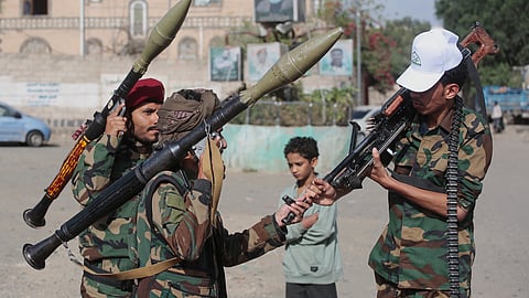 Yemen's Houthi rebels chat as they check their weapons during a mobilisation campaign in Sanaa, Yemen, Thursday, Sept. 10, 2026.