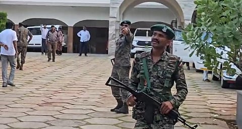 ED officials and security personnel at the premises of Satish Jarkiholi residence Hill Top in Gokak on Thursday evening.