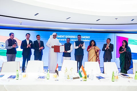 Chief Minister Mohan Charan Majhi with the MoU signed with  International Holding Company (IHC) and Adani Group at Abu Dhabi, in UAE on Wednesday