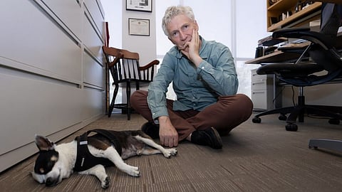 Emmanuel Mignot and his Chihuahua, Watson, who has narcolepsy