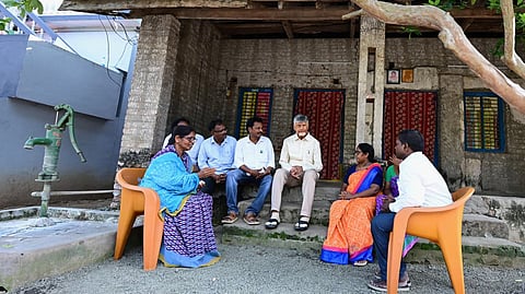 CM Nara Chandrababu Naidu interacts with the families living in ground rent sites at Machavaram of Ambazipet mandal on Wednesday. 