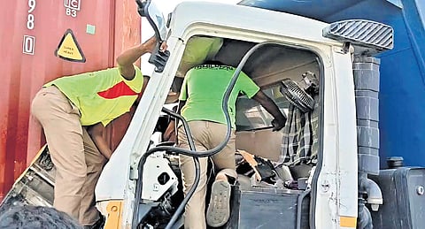 The mangled remains of the lorry tha hit the stationary container truck  near Pattabiram-Nemilichery on Saturday 
