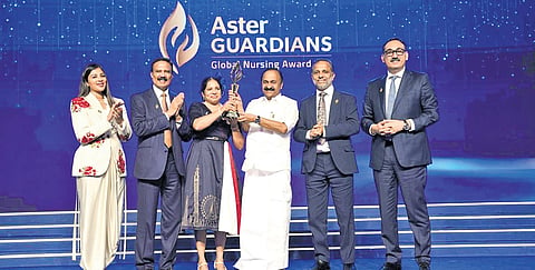 UK-based nurse Agimol Pradeep being presented with the Aster Guardians Global Nursing Award 2026 at a ceremony in Kochi on Saturday