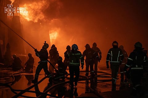 In this photo provided by the Ukrainian Emergency Service, firefighters put out a fire following a Russian drone attack in Kyiv, Dnipropetrovsk region, Ukraine, Friday, Sept. 11, 2026.