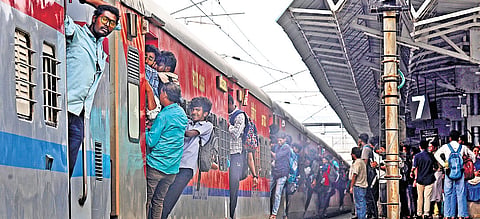 Passengers seen travelling dangerously on an overcrowded train departing from the Tambaram railway station on Saturday 