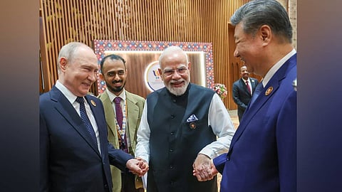 Prime Minister Narendra Modi with Chinese President Xi Jinping and Russian President Vladimir Putin at the BRICS Summit, in New Delhi on Saturday.