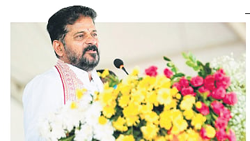 Chief Minister A Revanth Reddy addresses the gathering after laying the foundation stone for Arya Vysya Atma Gourava Bhavanam at Uppal on Sunday