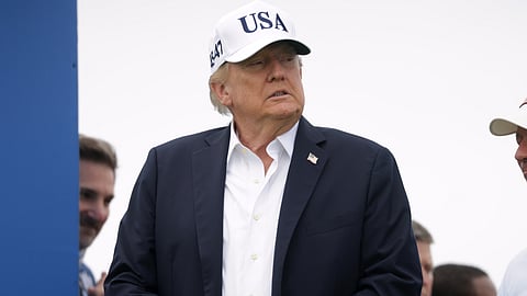 U.S. President Donald Trump arrives at the first tee during the Irish Open at the Trump International Golf Links course in Doonbeg, Ireland, Sunday, Sept. 13, 2026