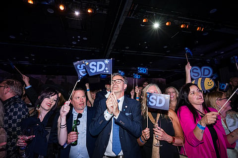 Supporters listen to far-right Sweden Democrats leader Jimmie Akesson deliver a speech at the party's election watch in Solna, near Stockholm, in the early hours of September 14, 2026.