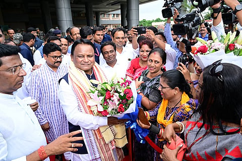 Chief Minister Mohan Charan Majhi being received by people at Biju Patnailk International Airport, in Bhubaneswar on Sunday.