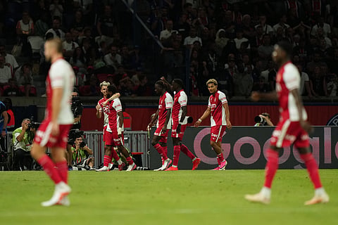 Monaco's players celebrate after Monaco's Stanis Idumbo, third form left, scored his side's second goal during the French League One soccer match between Paris Saint-Germain, and Monaco, in Paris,  on September 4 
