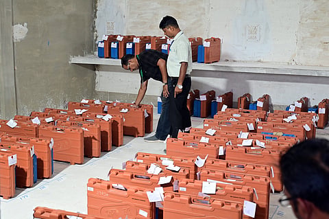 Election officials inspect (Electronic Voting Machines) EVMs kept at the counting centre at Government Polytechnic College ahead of counting of votes for the Bikaner Municipal Corporation elections, in Bikaner, Monday, Sept. 14, 2026. 