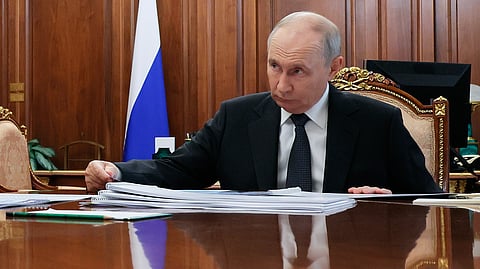 Russian President Vladimir Putin listens to Novgorod Region Governor Alexander Dronov at the Kremlin in Moscow, Monday, Sept. 14, 2026.
