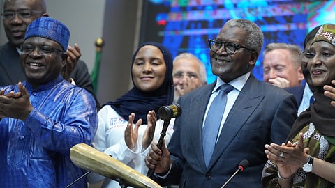 Nigerian industrialist Aliko Dangote, centre, participates in the Opening Gong Ceremony of the Dangote Refinery Initial Public Offer at the Nigeria Stock Exchange in Lagos Nigeria, Monday, Sept. 14, 2026. 