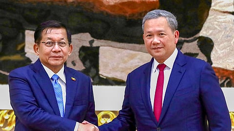 This handout photo taken and released by Agence Kampuchea Press (AKP) on September 11, 2026 shows Myanmar's President Min Aung Hlaing (L) shaking hands with Cambodia's Prime Minister Hun Manet (R) during a meeting at the Peace Palace in Phnom Penh.