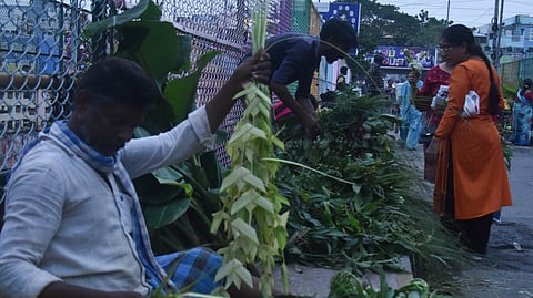 People purchasing pooja materials ahead of Ganesh Chaturthi in Vijayawada on Sunday.