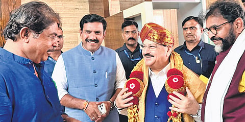 State BJP leaders R Ashoka, BY Vijayendra and Chaluvadi Narayanaswamy welcome Union Minister JP Nadda at Kempegowda International Airport on Tuesday  