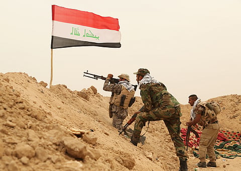 Fighters from the Badr Brigades Shiite militia clash with an Islamic State militant group at the front line on the outskirts of Fallujah in the Anbar province of Iraq, June 1, 2015.