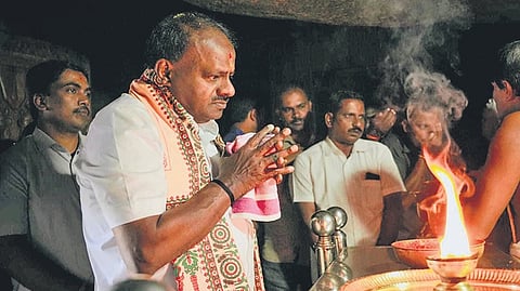 Union Minister HD Kumaraswamy prays at the Ranganathaswamy Temple at Mavinkere Hill in Holenarasipur taluk, Hassan district, on Tuesday | Express