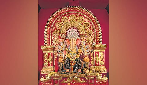 The idol of Lord Ganesh decorated with a brass tableau at a pandal at Mali Sahi, in Cuttack.