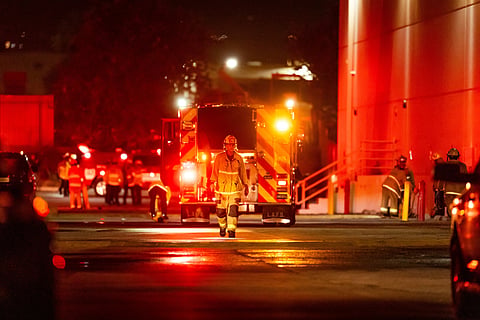 First responders work the scene after a helicopter crashed near a bus crash in Chatsworth, a neighborhood in Los Angeles, Tuesday, Sept. 15, 2026.
