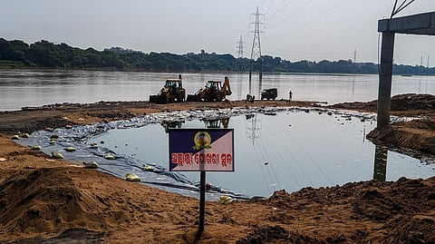 A temporary pond at Kuakhai river for Ganesh idol immersion.