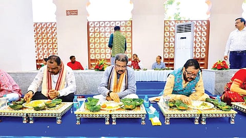 Sambalpur MP Dharmendra Pradhan taking part in community feast.