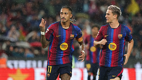 Barcelona's Raphinha celebrates scoring his team's fifth goal and a hat-trick during the Spanish league football match between FC Barcelona and Racing Santander at the Camp Nou stadium in Barcelona on September 16, 2026.