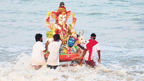 A Vinayagar idol being immersed at Kasimedu harbour on Wednesday.