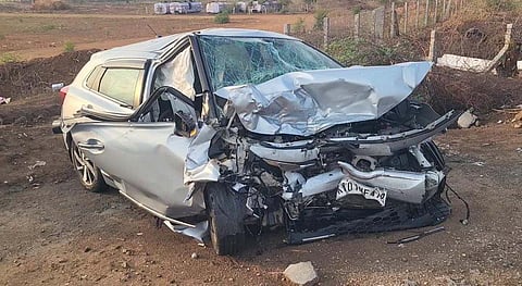 Mangled remains of the car in which the victims were travelling.