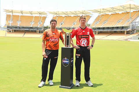 Jhye Richardson (L) of Perth Scorchers and Brendan Doggett of Melbourne Renegades pose with the BBL trophy at the MA Chidambaram Stadium 