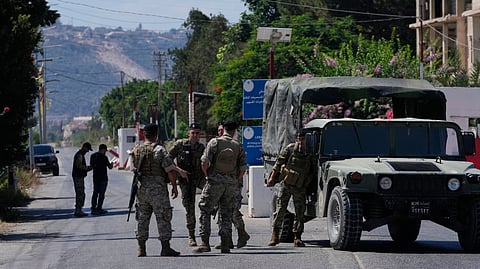 Lebanese army soldiers stand guard at a checkpoint near the border with Israel in the southern village of Mansouri, Lebanon, Friday, Sept. 4, 2026.