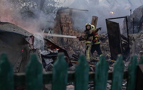 In this photo provided by the Ukrainian Emergency Service, firefighters put out a fire at private homes following a Russian air attack in Sumy, Ukraine, Wednesday, Sept. 16, 2026.